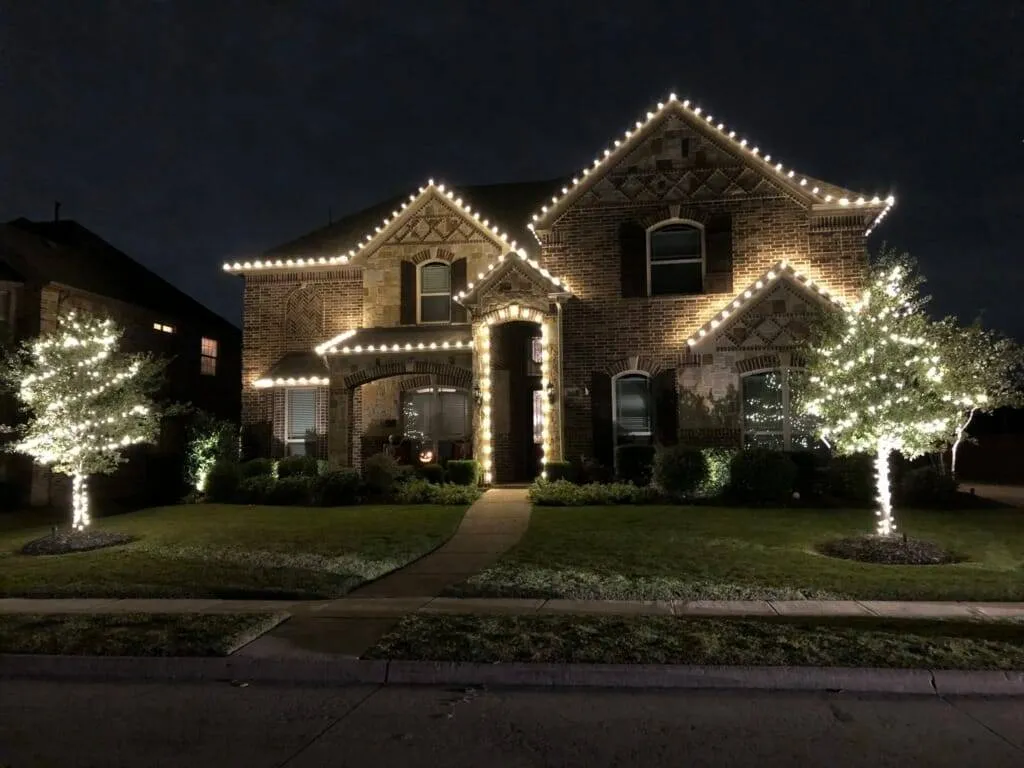 Warm white lights on gables and columns